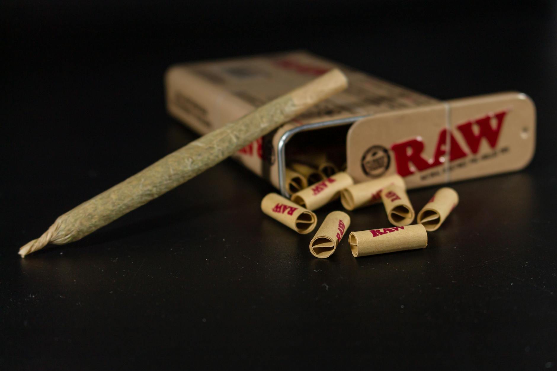 collection of raw rolling papers with pre roll joint