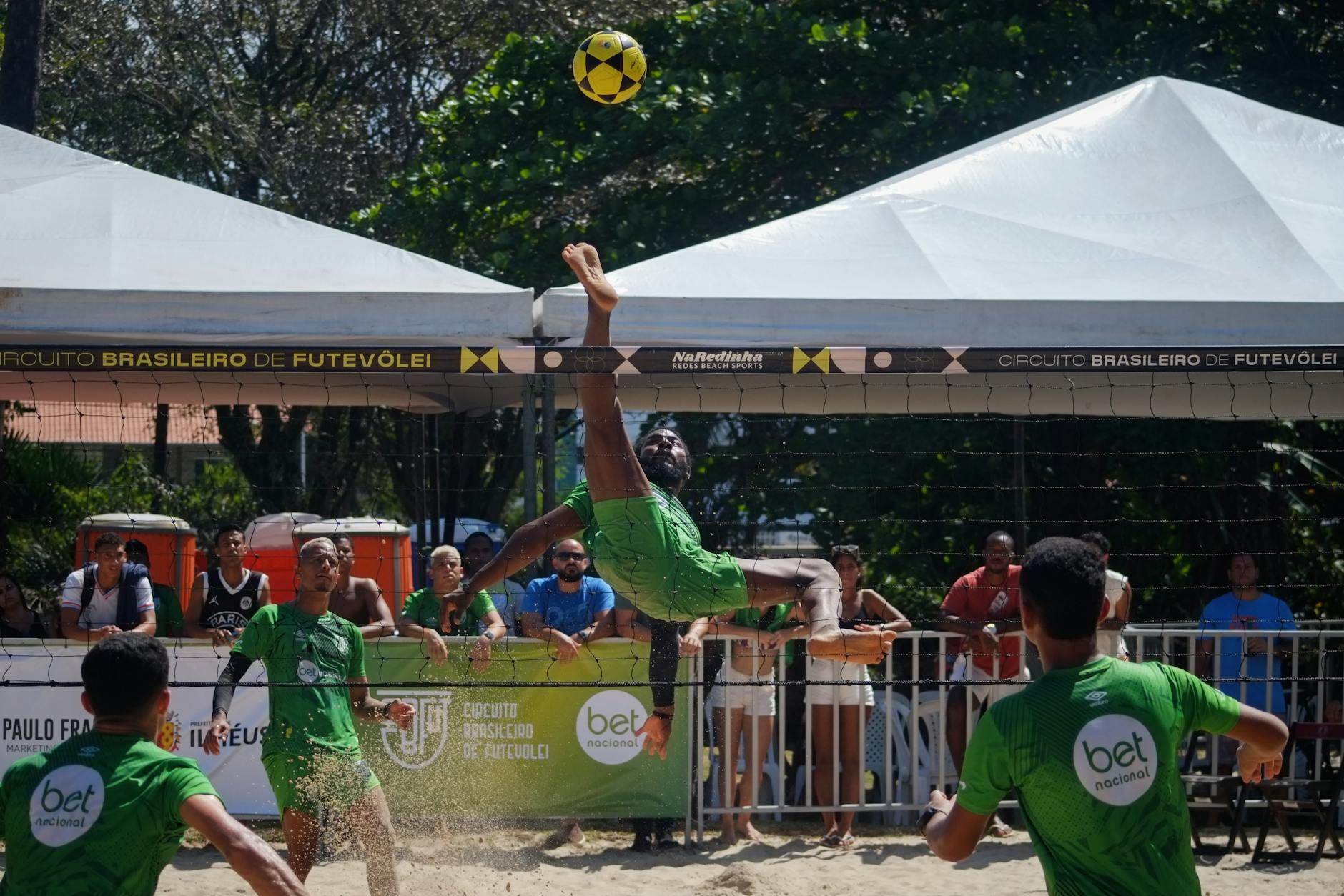 dynamic futevolei match on brazilian beach